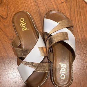 Gold and white sandals